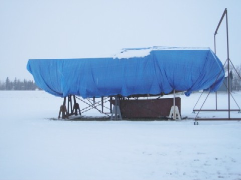 The hull is covered by snow